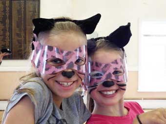 Two little cats dressed for the performance